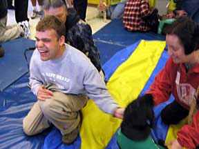 Blind student is all smiles. Cynthia's body is a blurr in the photo..
