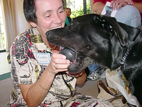 Bev gives Cynthia her old kong from puppy days.