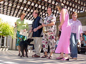 On stage with instructor, black lab, Justin, Bev, Marikay, and Pat